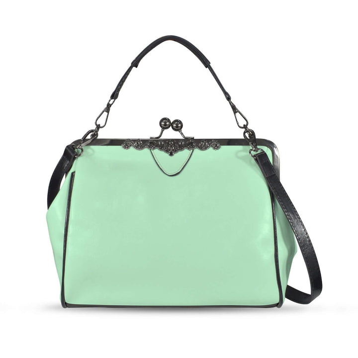Mint green vintage kisslock handbag with a structured design and black accents, perfect for a retro look.