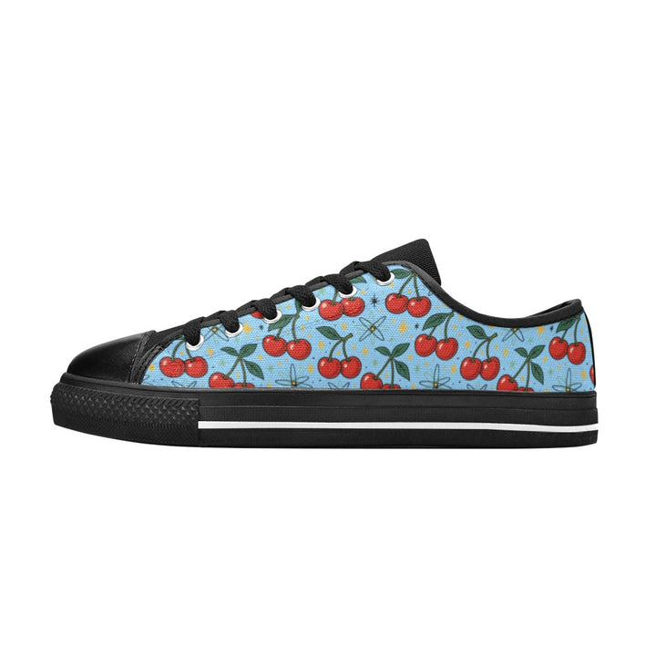 Atomic Cherries Kids Sneakers(B) featuring vibrant cherry patterns on a light blue canvas background.