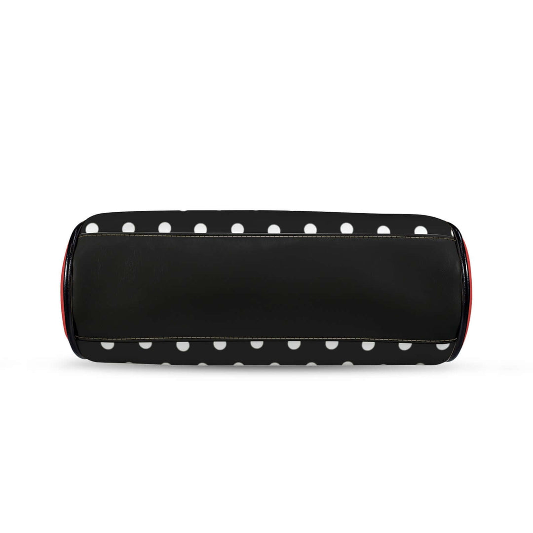Polly Kisslock Vintage Handbag in black and white polka dots with red trim, showcasing a stylish retro design.