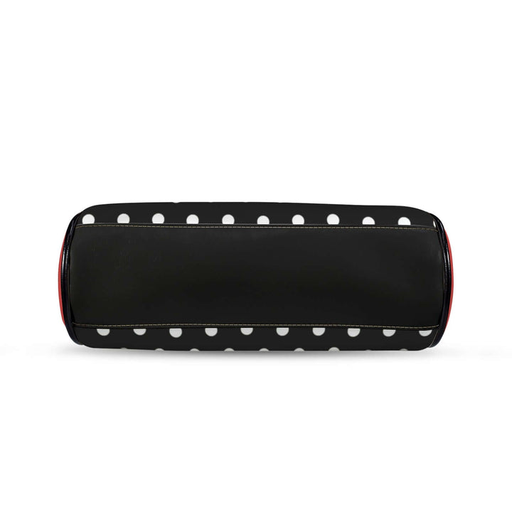 Polly Kisslock Vintage Handbag in black and white polka dots with red trim, showcasing a stylish retro design.