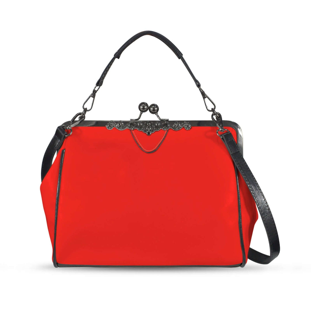 Red vintage kisslock handbag with structured design and black strap, a stylish accessory for a retro look.