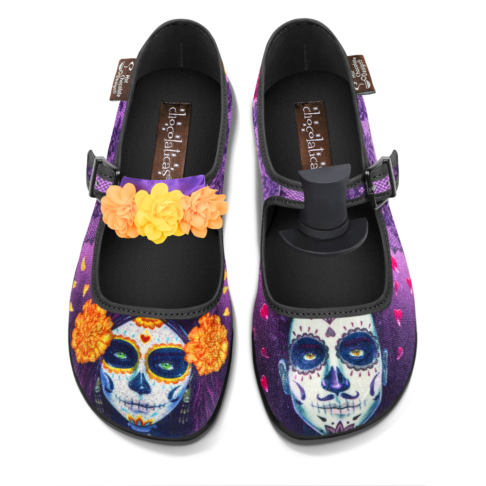 Hot Chocolate Design Dia de Muertos mary janes with vibrant Day of the Dead artwork and themed accessories.