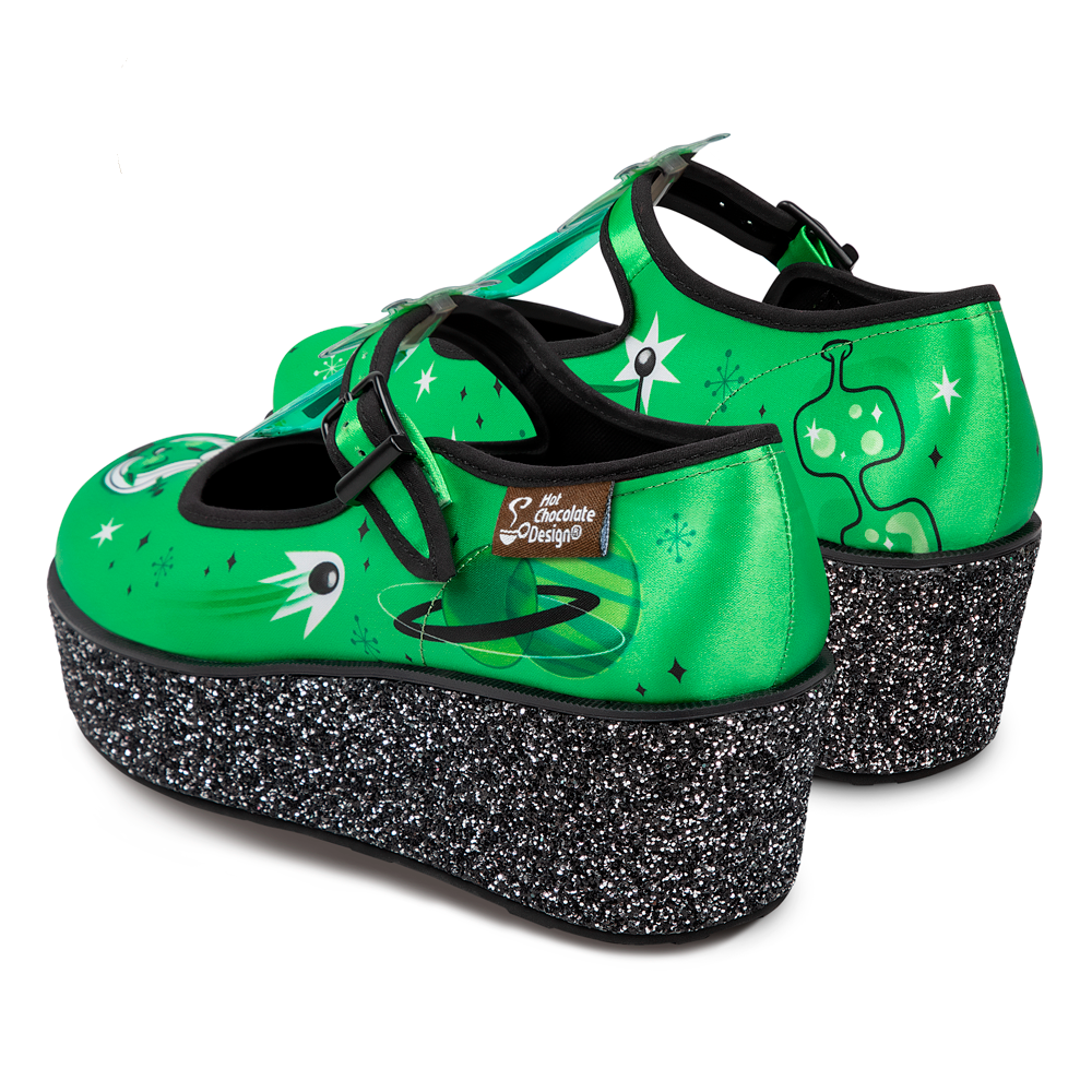 Hot Chocolate Design ET Gals Platform shoes featuring a vibrant green canvas upper and chunky glitter sole.