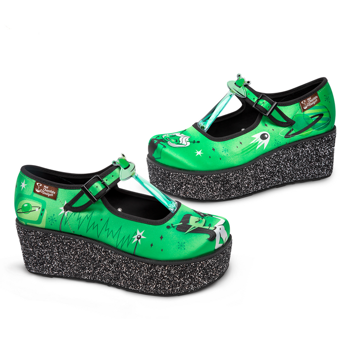 Hot Chocolate Design ET Gals Platform shoes in vibrant green with extraterrestrial artwork and chunky glitter sole.