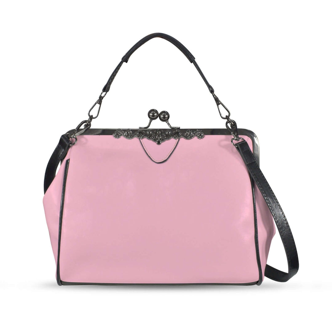 Kisslock vintage handbag in pink with black straps, showcasing a classic 1950s design and modern versatility.