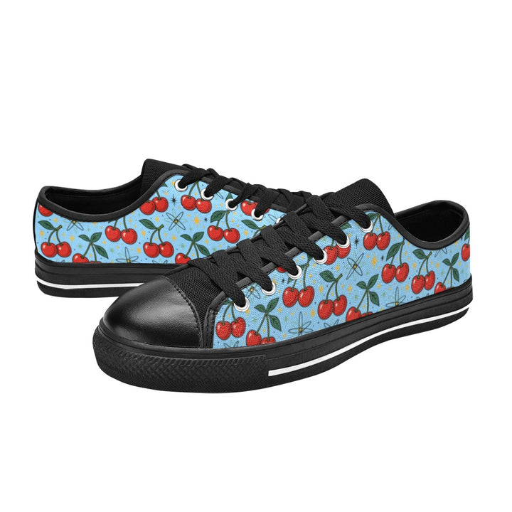 Atomic Cherries Kids Sneakers(B) with cherry print on a blue background and black accents.