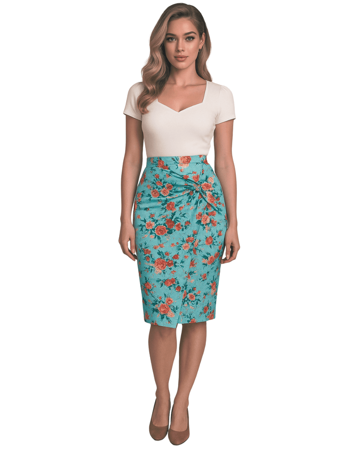 Woman wearing a white top and floral pencil skirt on a white background