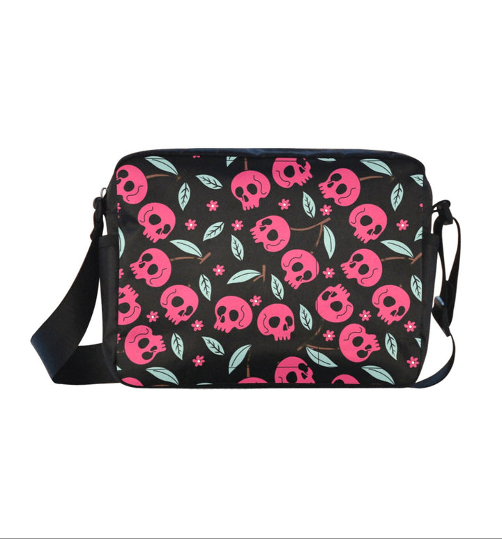Cherry Skulls Crossbody Bag with pink skulls and green leaves on a black background, perfect for edgy style and daily use.