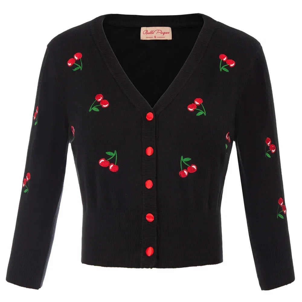 Cropped black cardigan with cherry embroidery and red buttons, perfect for a vintage-inspired outfit.