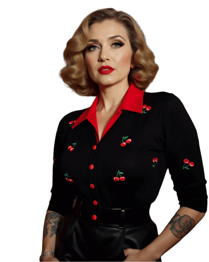 Cropped cherry cardigan with playful embroidery and red collar, styled for a retro look.