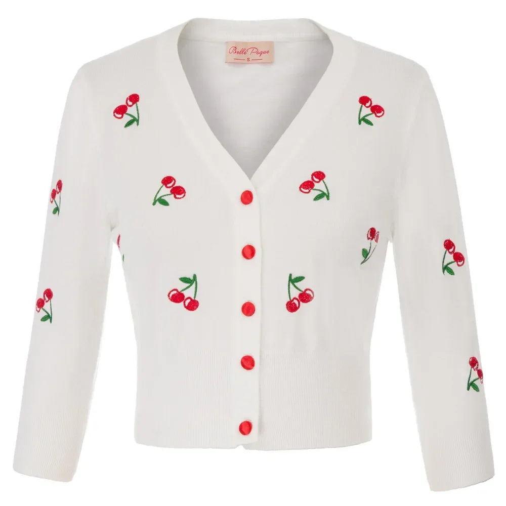 Cropped white cardigan with red cherry embroidery and buttons, stylish and vintage-inspired fashion piece.
