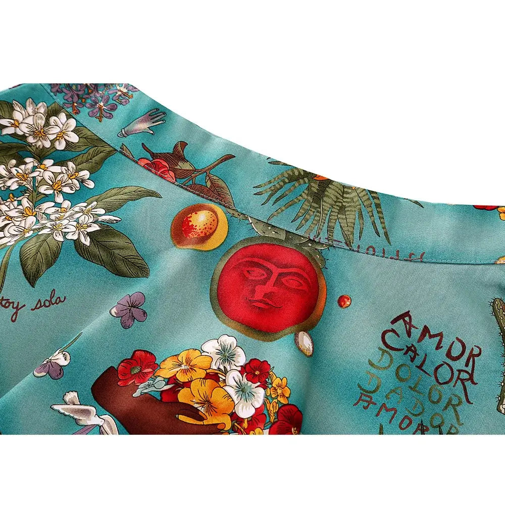 Vibrant floral and artistic print detail on Frida Kahlo inspired flared skirt, showcasing bright colors and unique designs.