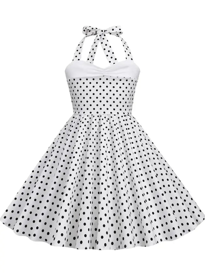 Girls polka dot halter rockabilly dress in white and black, knee-length A-line silhouette with playful print.