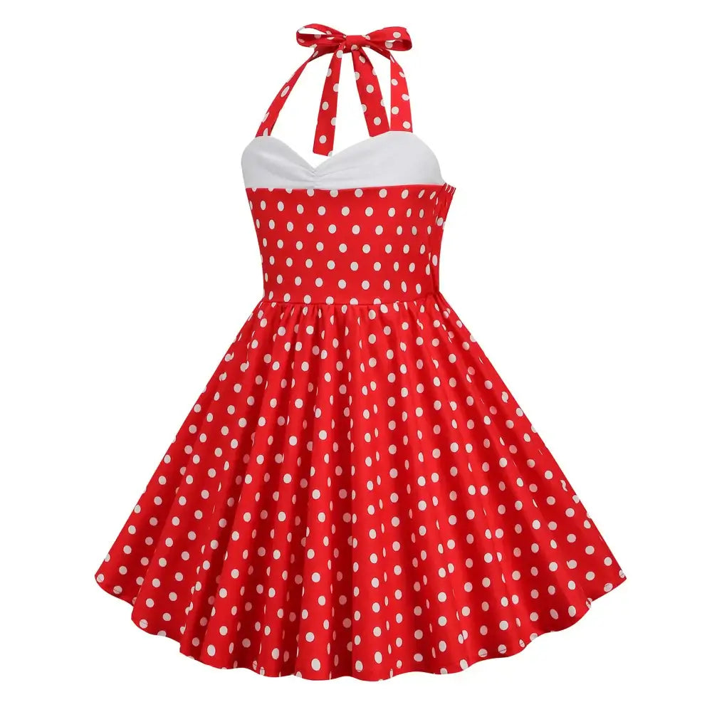 Girls polka dot halter rockabilly dress in red with white dots, knee-length A-line silhouette perfect for twirling.
