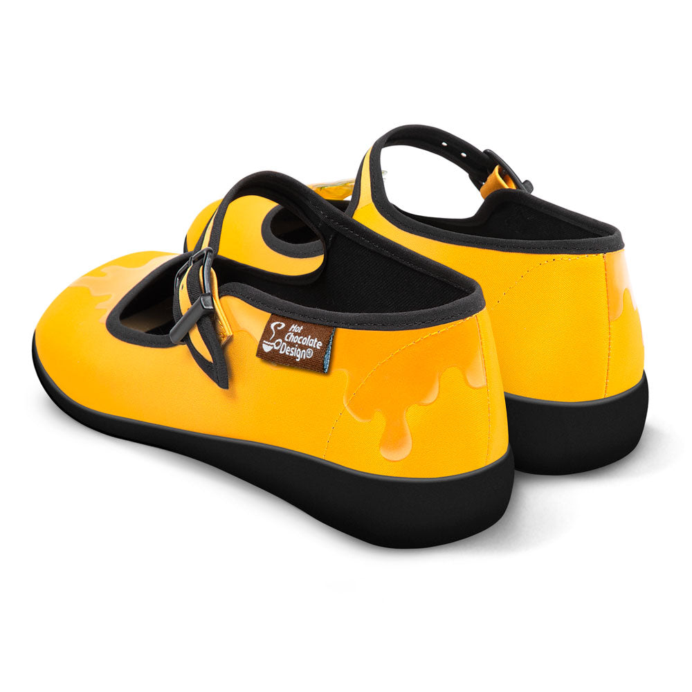 Hot Chocolate Design Oh Honey! stylish yellow mary janes with honey-drip accents and black sole, perfect for fun footwear.