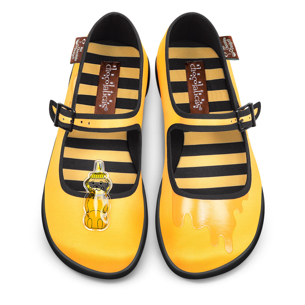 Hot Chocolate Design Oh Honey! Chocolaticas with honey bear accessory and striped interior in golden yellow.