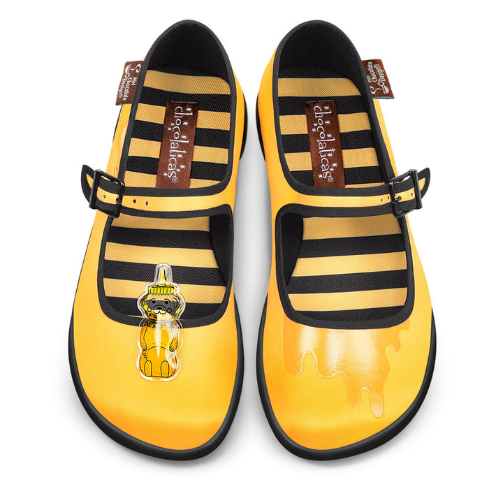 Hot Chocolate Design Oh Honey! Chocolaticas with honey bear accessory and striped interior in golden yellow.