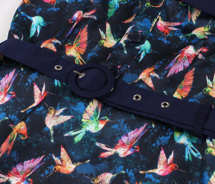 Hummingbird Print Sweetheart Halter A-Line Dress detail featuring vibrant hummingbird patterns and navy blue belt.