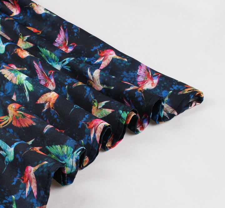 Hummingbird Print Sweetheart Halter A-Line Dress fabric with colorful hummingbirds on navy blue background.