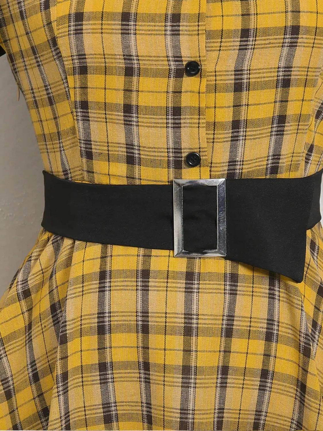 Detail of Lucille Plaid Single Breasted 50s Dress featuring a black belt and yellow plaid fabric design.