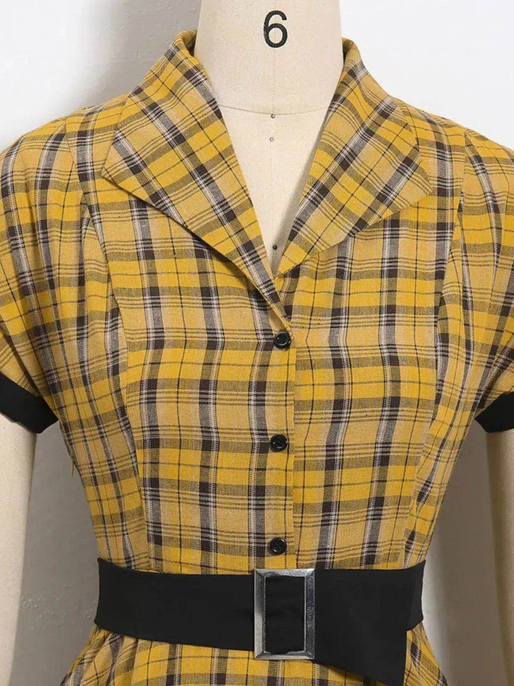 Close-up of Lucille Plaid Single Breasted 50s Dress showcasing yellow plaid fabric and stylish belt detail.