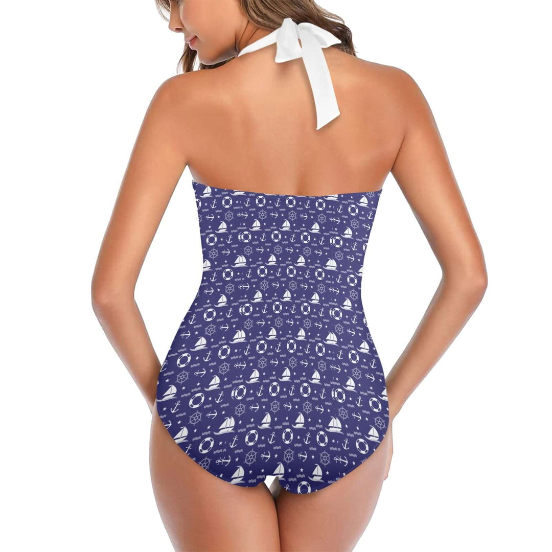 Woman wearing a Nautical Women's Halter Underwire Swimsuit with a blue pattern, showcasing the back design and halter tie.