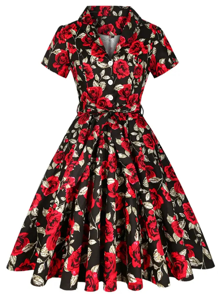 Rose Romance Vintage Swing Dress with red floral pattern on a classic black background, perfect for weddings and parties.