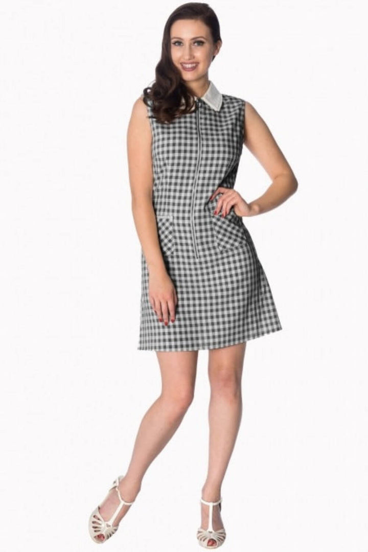 Model in a sleeveless black-and-white check Summer Breeze Collar Dress featuring a contrasting collar and front zip.