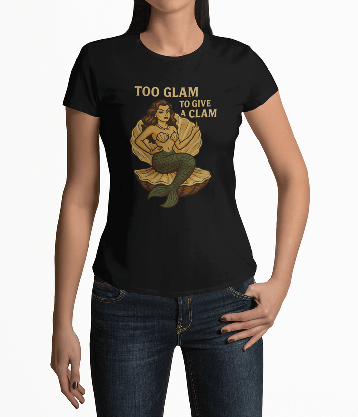 Too Glam to Give a Clam women's black tee featuring a glamorous mermaid in a clam, perfect for beach lovers.