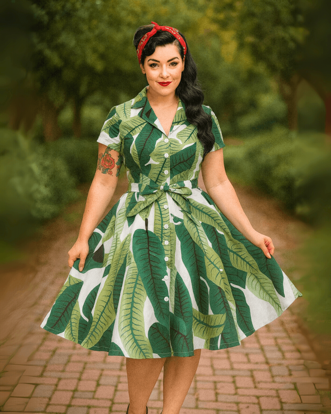 Model wearing the Tropical Leaves Vintage Swing Dress, featuring a vibrant tropical leaf pattern and a flattering silhouette.