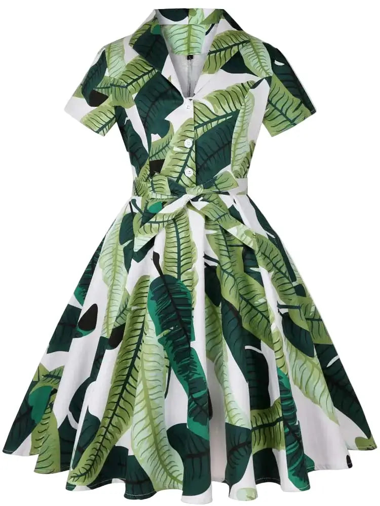 Tropical Leaves Vintage Swing Dress featuring a lively tropical leaf pattern and a flattering swing silhouette.