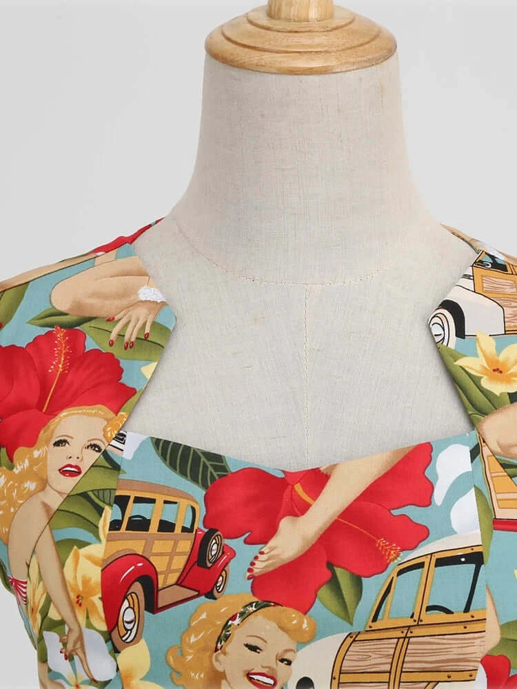 Tropical Pinups Pencil Dress detail featuring vintage pin-up girls and vibrant floral print on a mannequin.