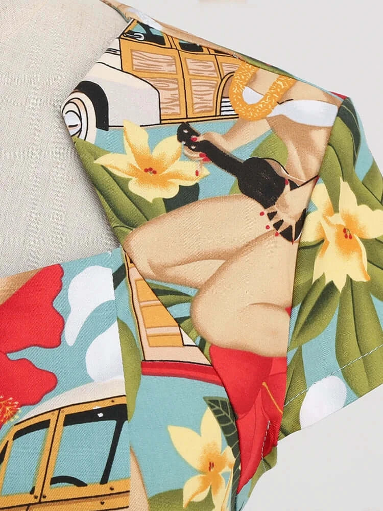 Close-up of Tropical Pinups Pencil Dress featuring vintage pin-up design and vibrant tropical florals.