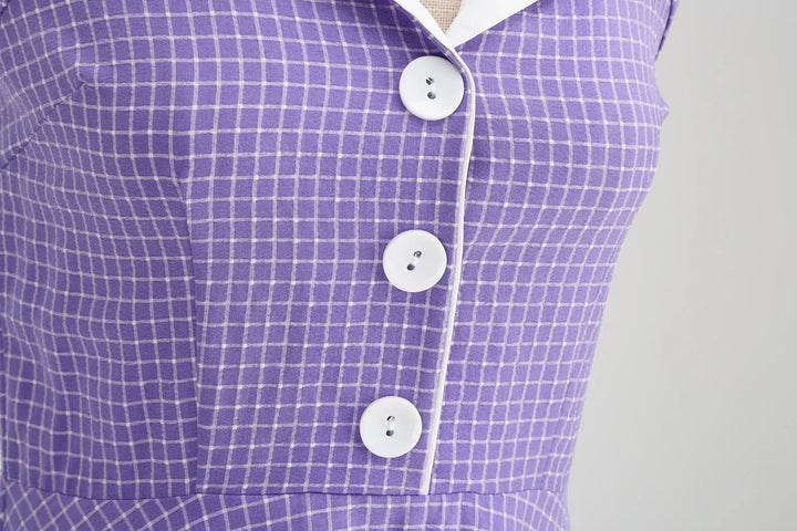 Vintage Lavender Halter Swing Dress with Pockets close-up of buttons and fabric detail.