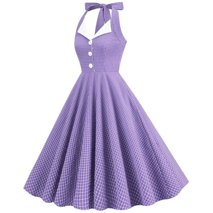 Vintage Lavender Halter Swing Dress with Pockets showcasing a playful check pattern and flattering A-line silhouette.