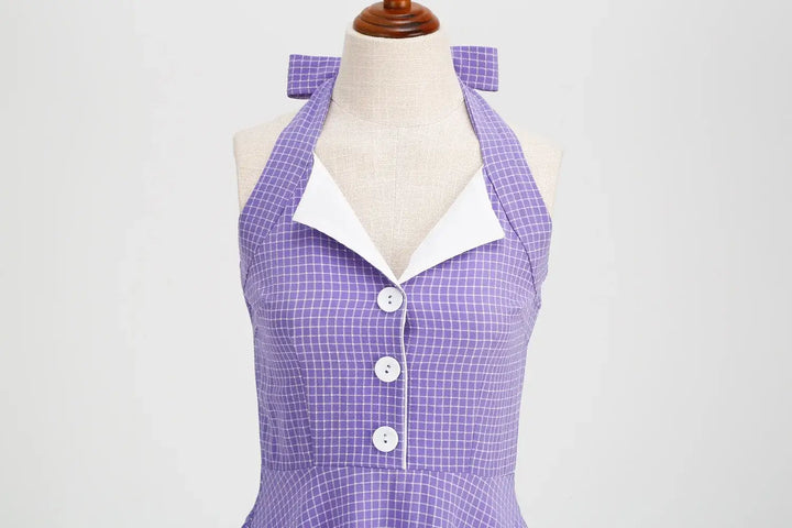 Vintage Lavender Halter Swing Dress with Pockets featuring a halter neckline and button details.