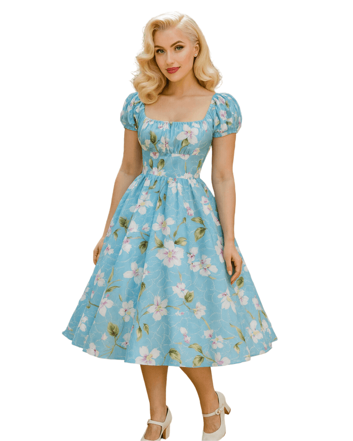 Vintage Peasant Style Blue Floral Dress showcasing a light blue floral design, with puff sleeves and a square neckline.