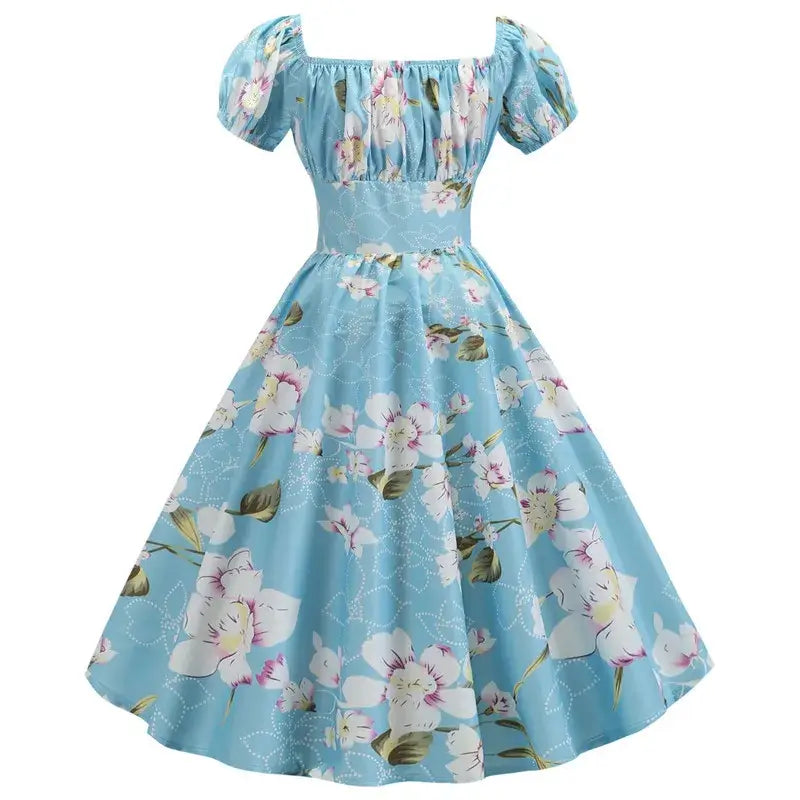 Vintage Peasant Style Blue Floral Dress featuring a square neckline and puff sleeves, adorned with a floral pattern.