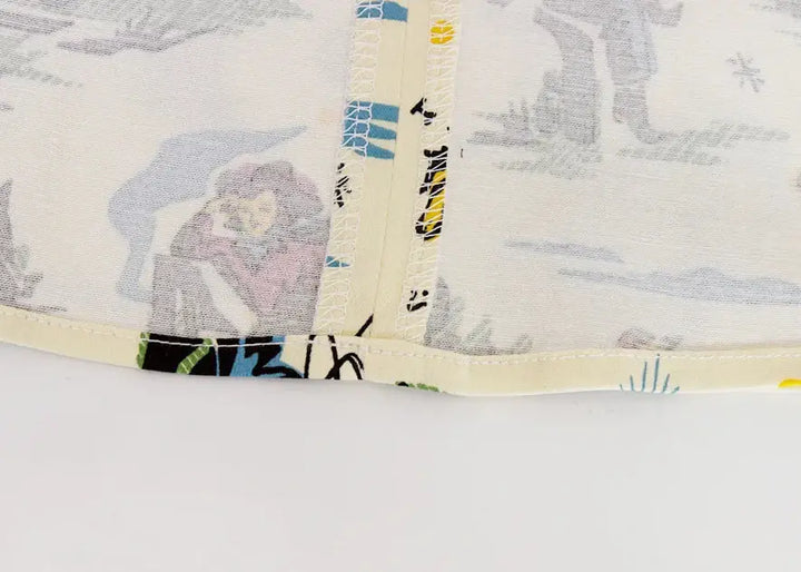 Close-up view of the fabric detail on a Western Cowboy Flared Skirt featuring playful vintage patterns.