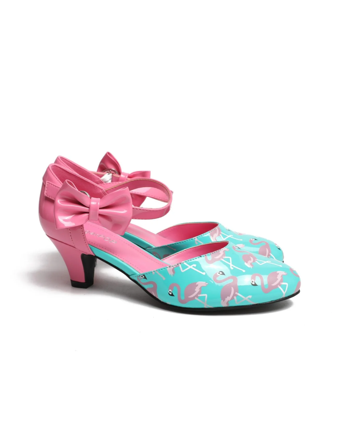 SugarPOP Mingo quirky kitten heels with pink flamingo print, adjustable heart-shaped buckle, and removable bow accent.