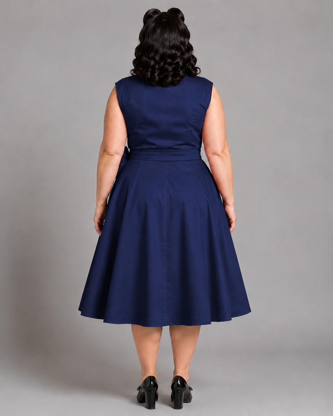 Vivienne blue A-line dress on a UK16 model showing the high back and full skirt