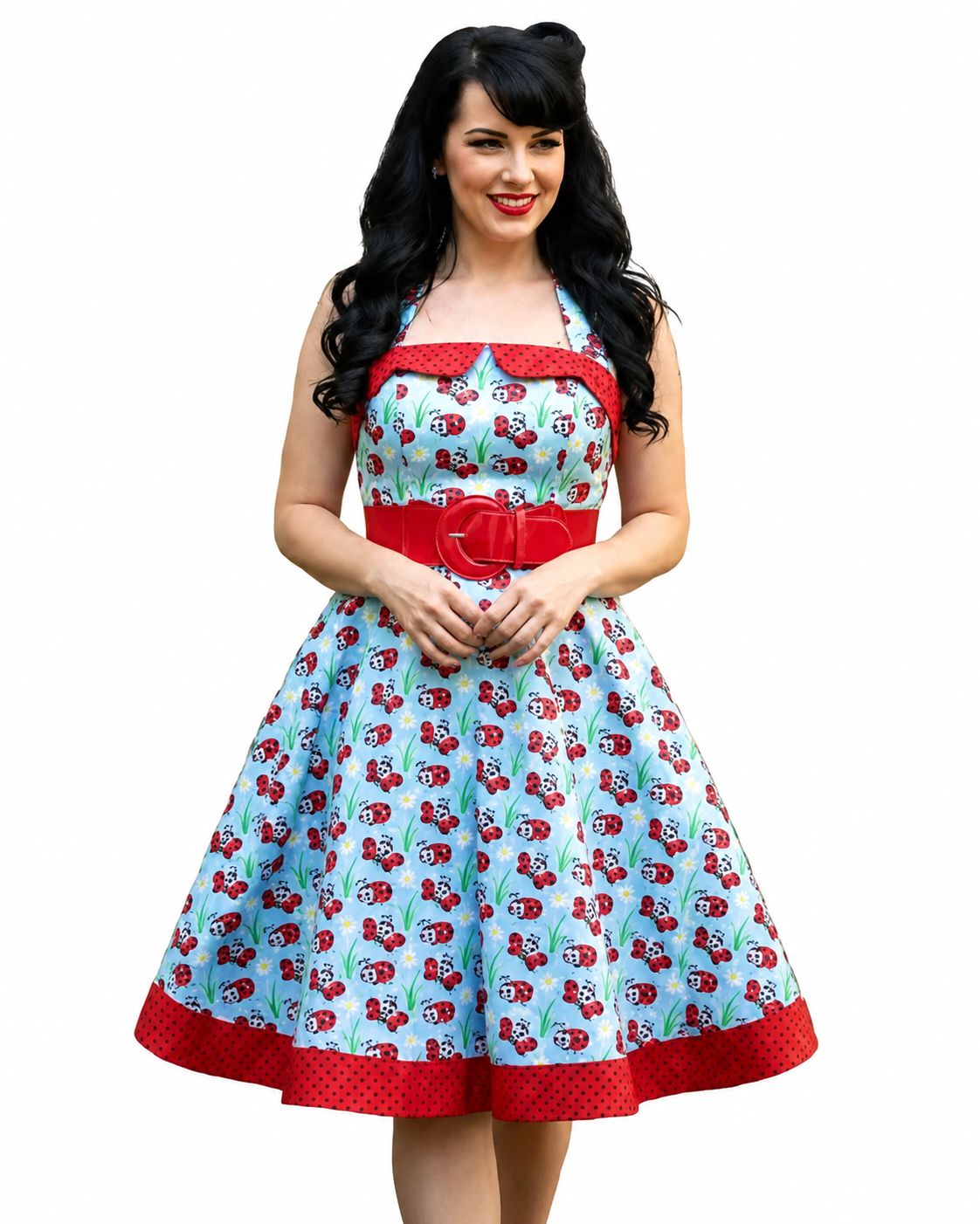 Woman wearing a vintage-style dress with a red belt and ladybugs pattern on a white background