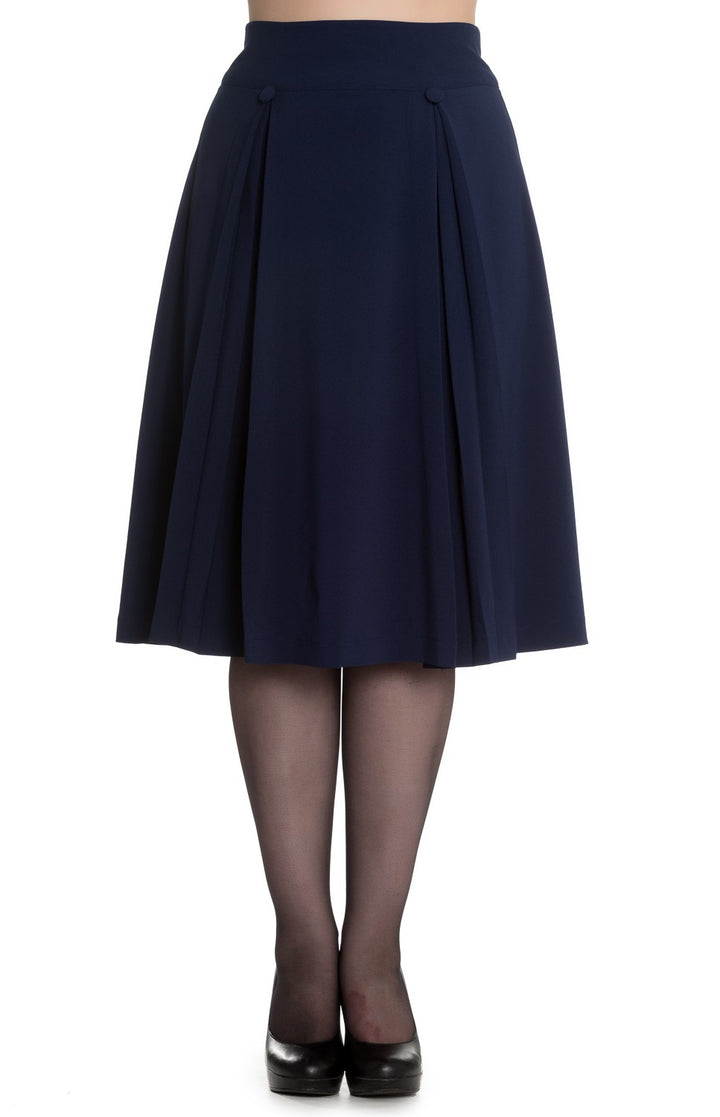 Navy blue skirt worn with black tights and shoes on a white background