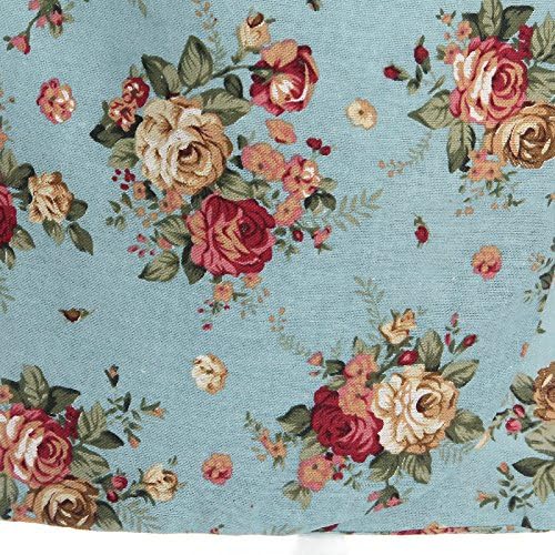 Close-up of vibrant floral pattern featuring roses on a blue fabric, perfect for vintage-inspired fashion.