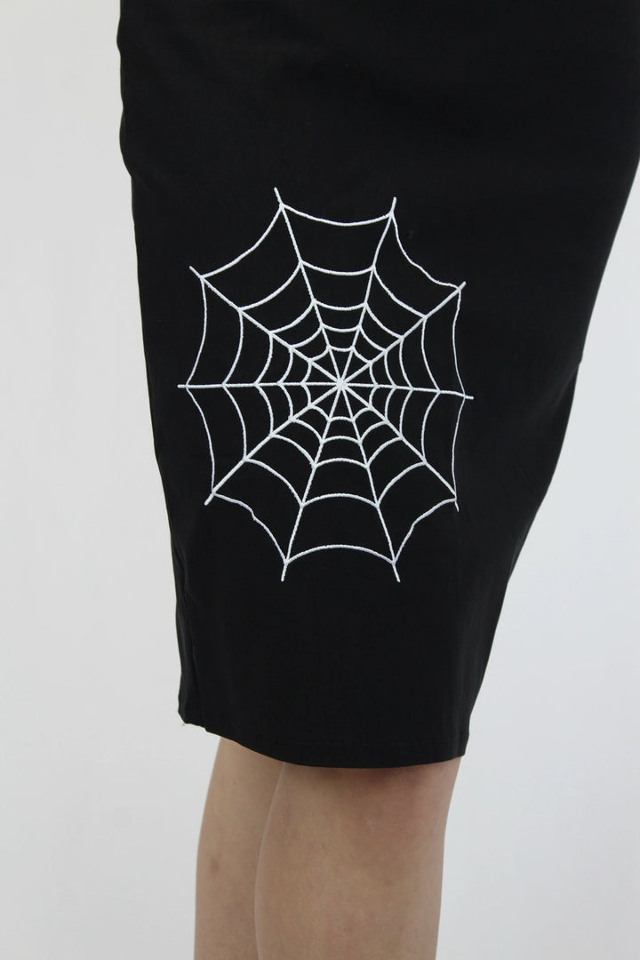 White spiderweb detail on black fitted pencil skirt