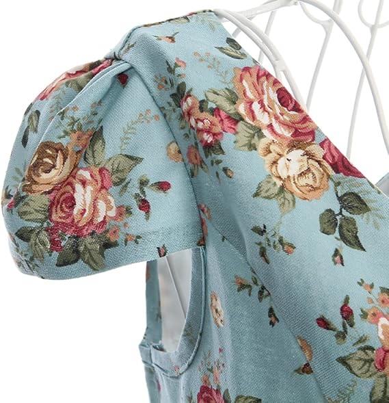 Close-up of the cap sleeve and floral print of the Maisie Floral Pencil Dress, featuring roses on blue fabric.