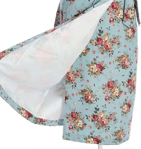Maisie Floral Pencil Dress showcasing vintage rose print on a blue background with a flowing skirt detail.