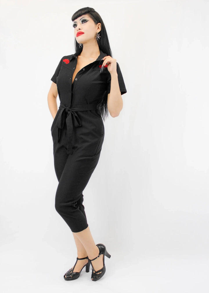 Black snap-front jumpsuit with red embroidered roses