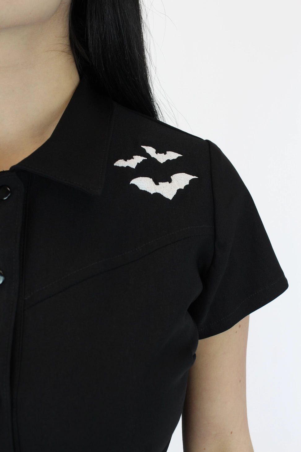 Women’s black bat playsuit with attached tie belt