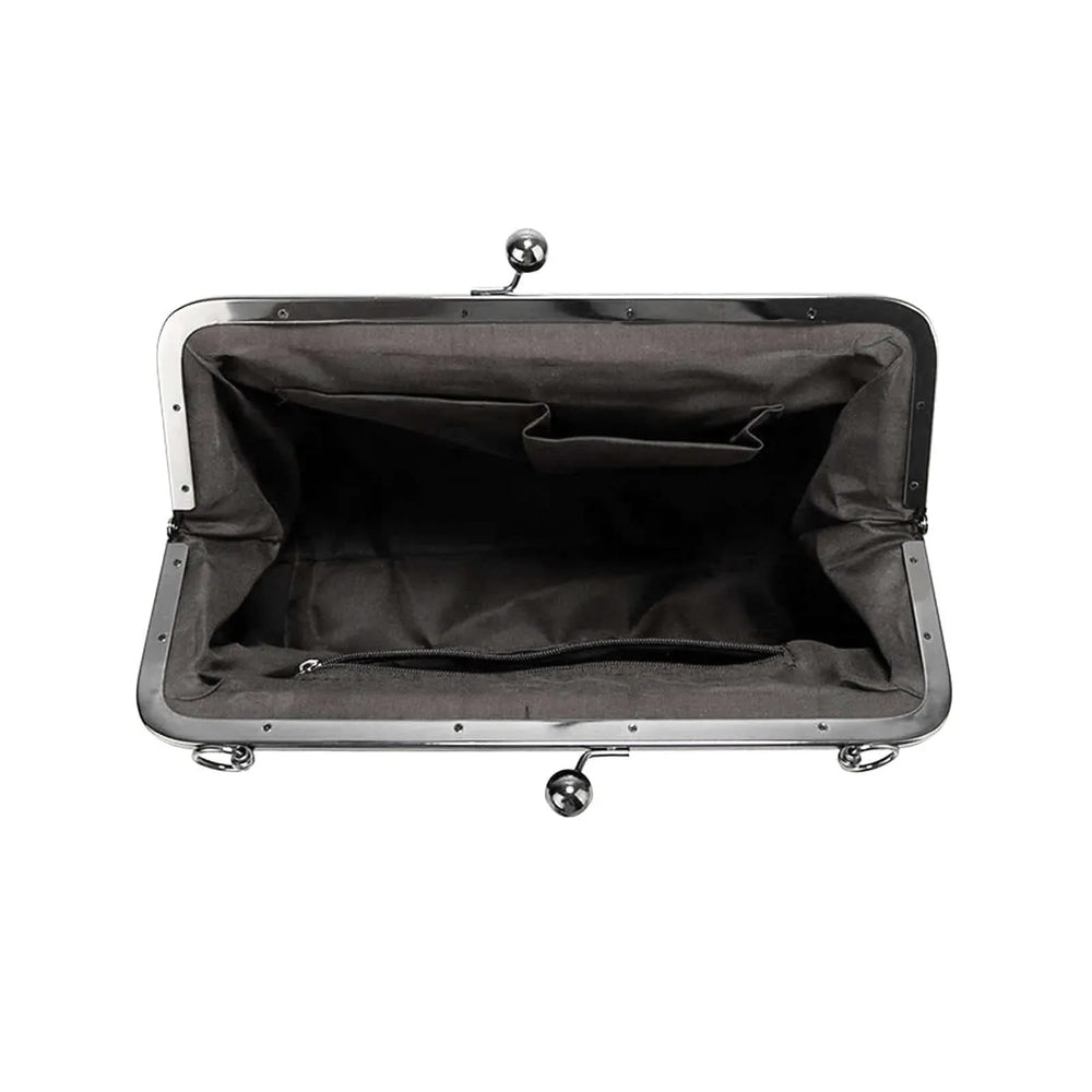 Interior view of the Handbag Vintage Kisslock La Cheetah featuring spacious compartments and classic vintage design.